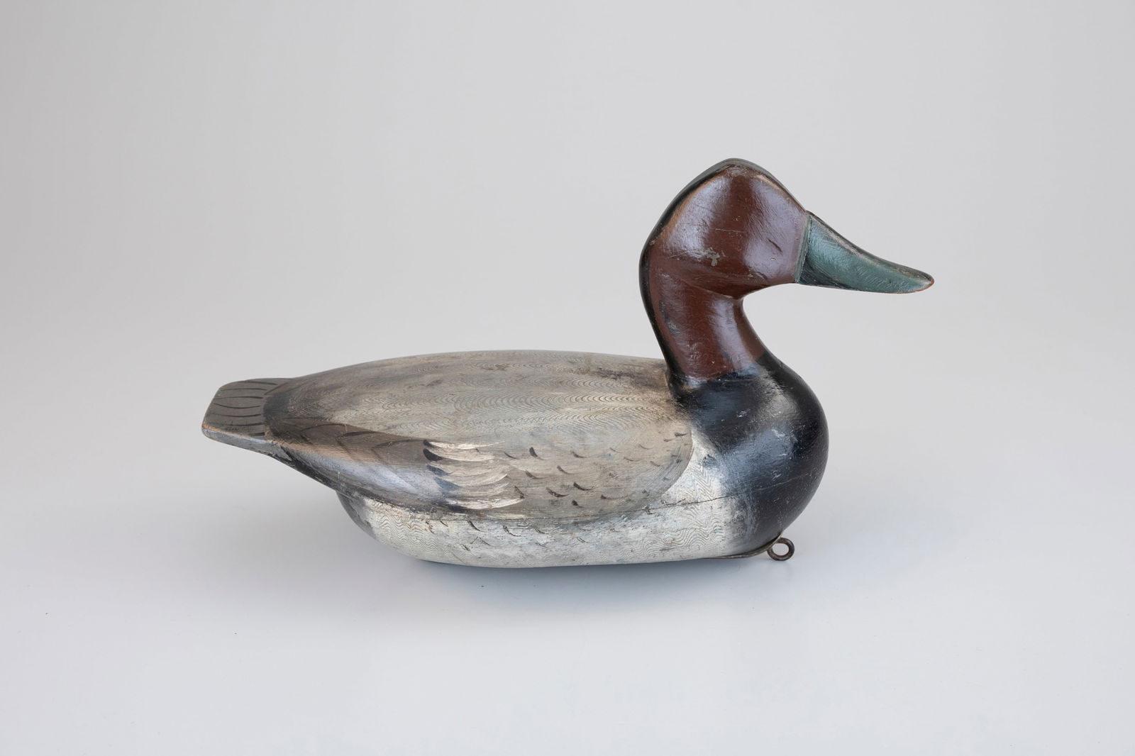 Masterworks Canvasback by Verne Cheeseman (1897-1956): Masterworks Canvasback Verne Cheeseman (1897-1956) Macomb, IL, c. 1930 14 in. long This exceedingly rare decoy features Cheeseman's distinct high-head carving with Edna Perdew's best combed feather pa