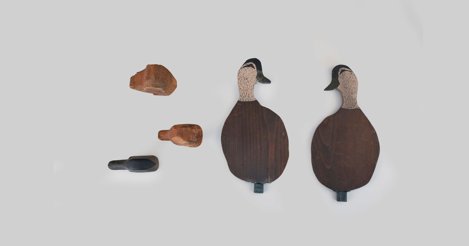 Two Black Duck Silhouettes and Three Heads by Louis C. Rathmell (1898-1974): Two Black Duck Silhouettes and Three Heads Louis C. Rathmell (1898-1974) Danbury, CT, c. 1950 duck is 14 1/2 in. tall As found. Provenance: Louis Rathmell Private Collection, by descent in the