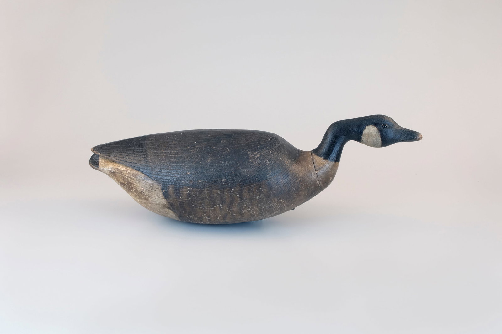 Cobb-Style Hissing Canada Goose by Mark McNair (b. 1950): Cobb-Style Hissing Canada Goose Mark McNair (b. 1950) Craddockville, VA, c. 1990 25 in. long This hollow decoy is modeled after the famous Adele Earnest decoy, which is now featured on the front dust
