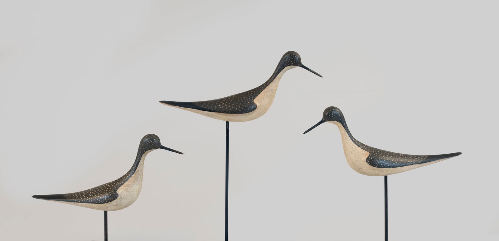 Rig of Three Yellowlegs by Ian McNair (b. 1981): Rig of Three Yellowlegs Ian McNair (b. 1981) Craddockville, VA, 2025 13 in. long This trio of yellowlegs is gracefully carved and painted with an incised "I McNair" signature on underside of each. Ori