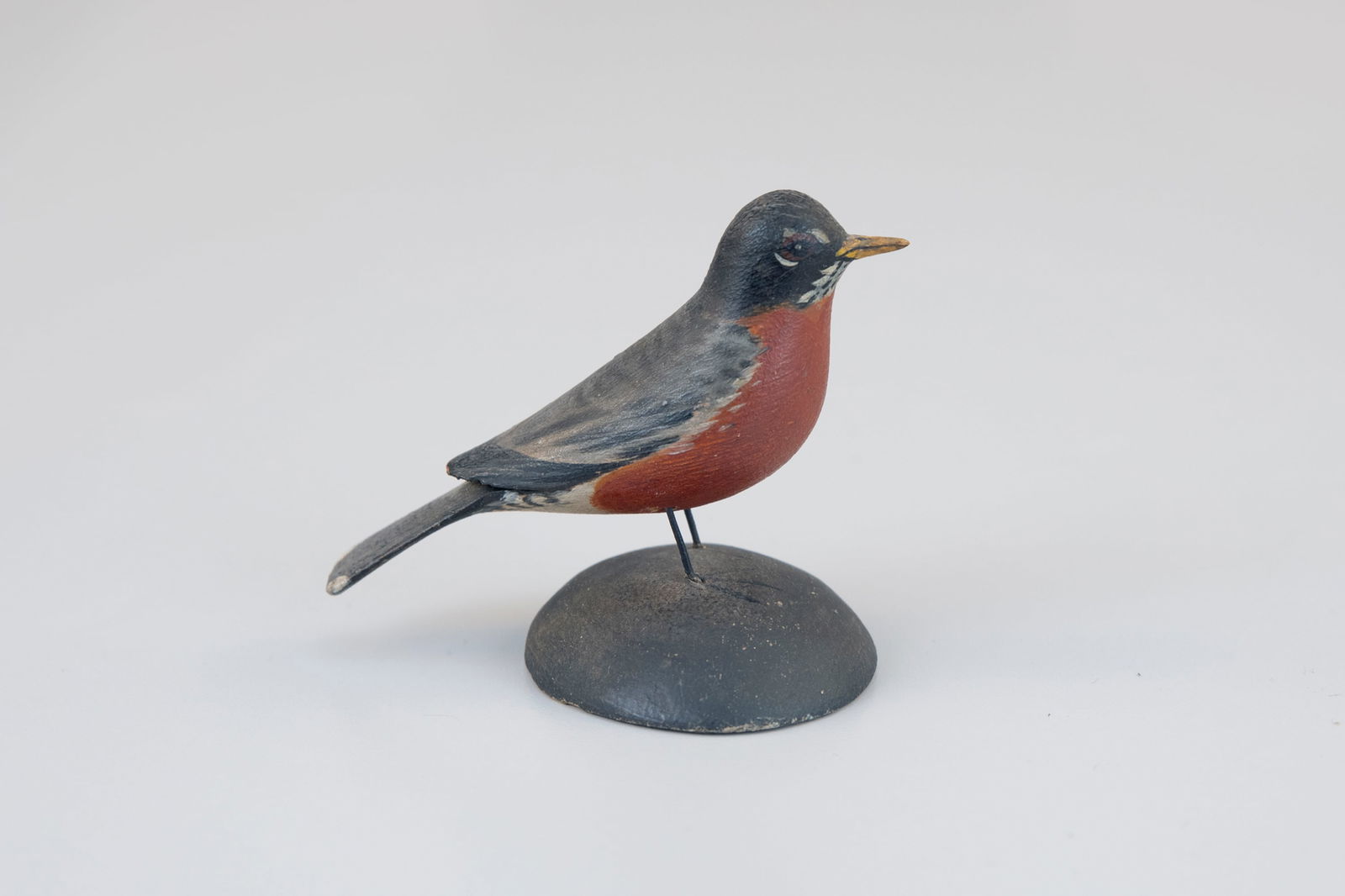 Miniature Robin by A. Elmer Crowell (1862-1952): Miniature Robin A. Elmer Crowell (1862-1952) East Harwich, MA, c. 1930 2 1/2 in. tall A split-tail carving with the maker's rectangular stamp signature on the underside. Original paint with light wear