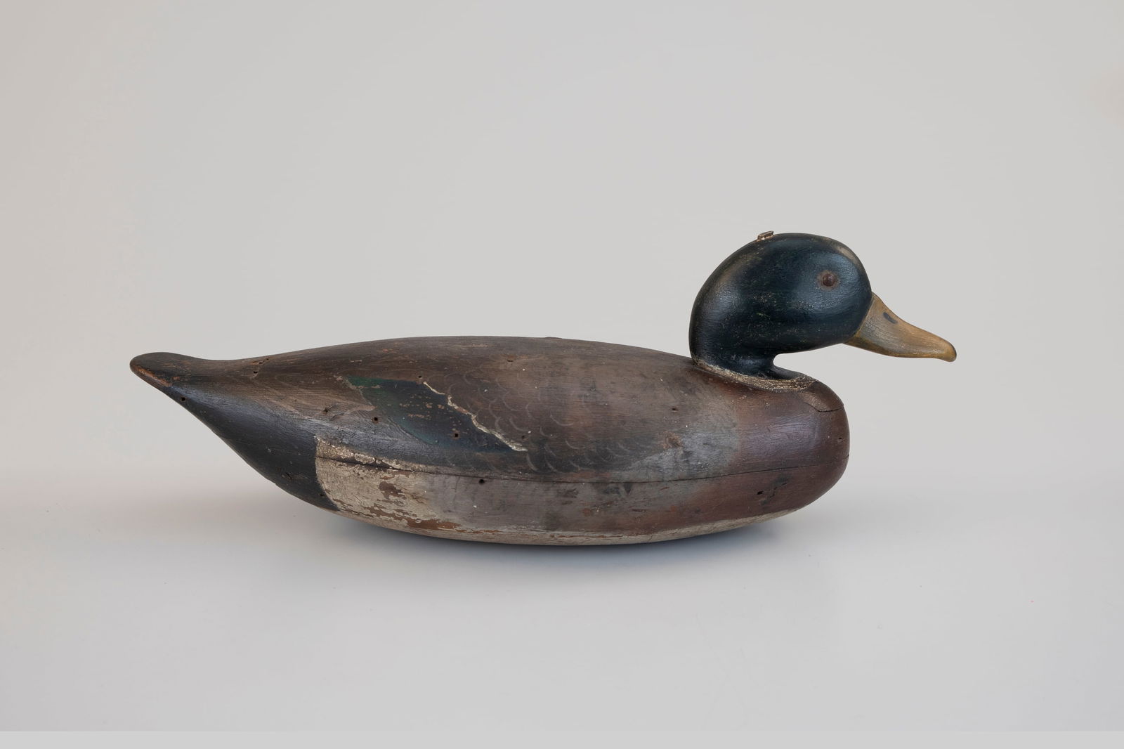 Porter Rig Mallard: Porter Rig Mallard Philadelphia, PA, c. 1870 18 in. long A grand hollow carving in the Philadelphia School style with a "J. H. Porter" brand on the underside. There is an inlaid head, pinched