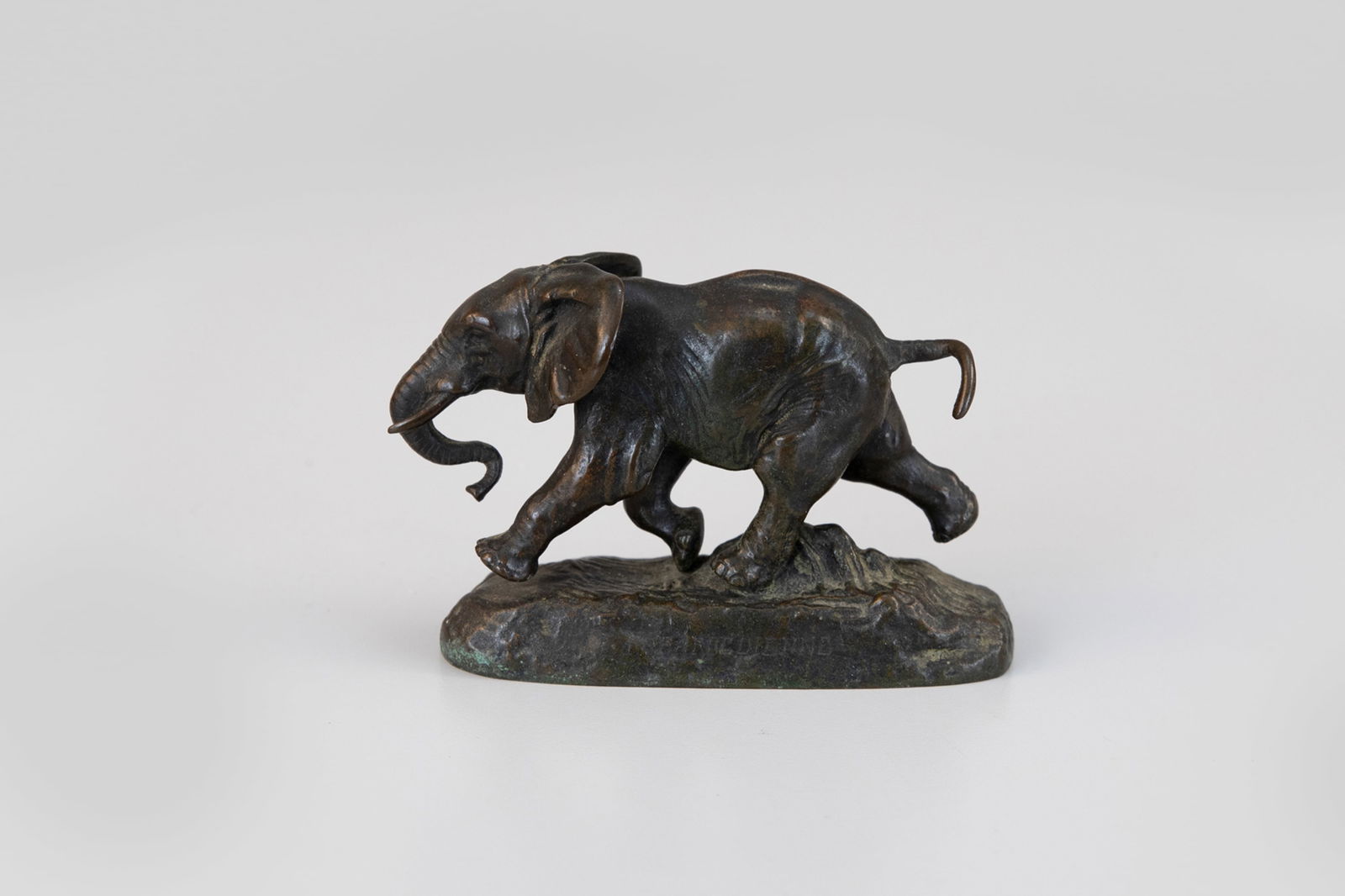 Antoine-Louis Barye (French, 1795-1875), Running Elephant: Antoine-Louis Barye (French, 1795-1875) Running Elephant signed "Barye" on right side of base bronze, 3 by 4 by 1 3/4 in. Foundry mark "F. Barbedienne" on left side of base Stamped "43" in underside o