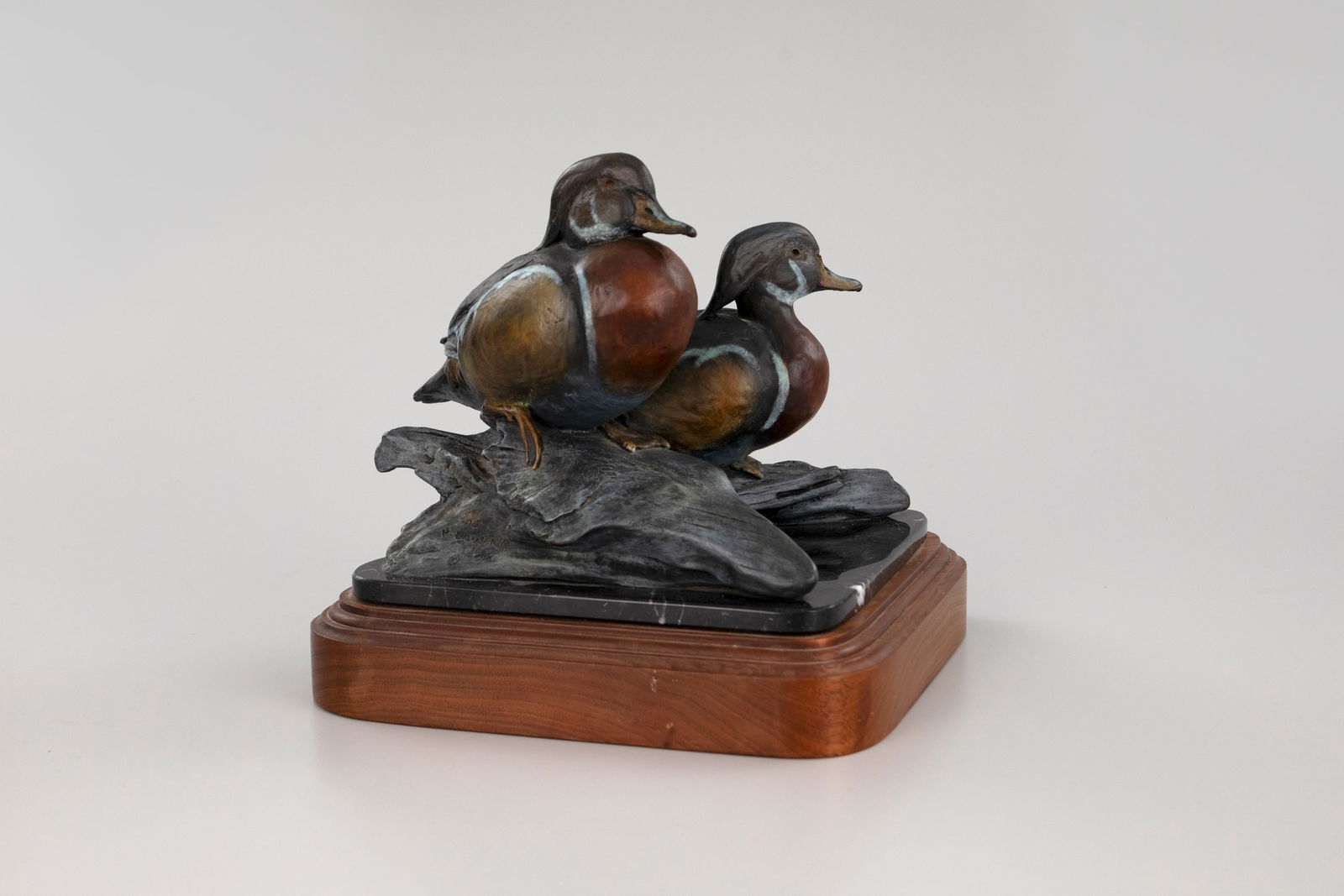 Ronald W. Lowery (20th Century), Wood Ducks: Ronald W. Lowery (20th Century) Wood Ducks, 1993 signed, dated, and numbered "93, R. Lowery 14/25" on base bronze, 9 in. tall, 13 in. wide edition 14 of 25 A colorful patinated bronze depicting two