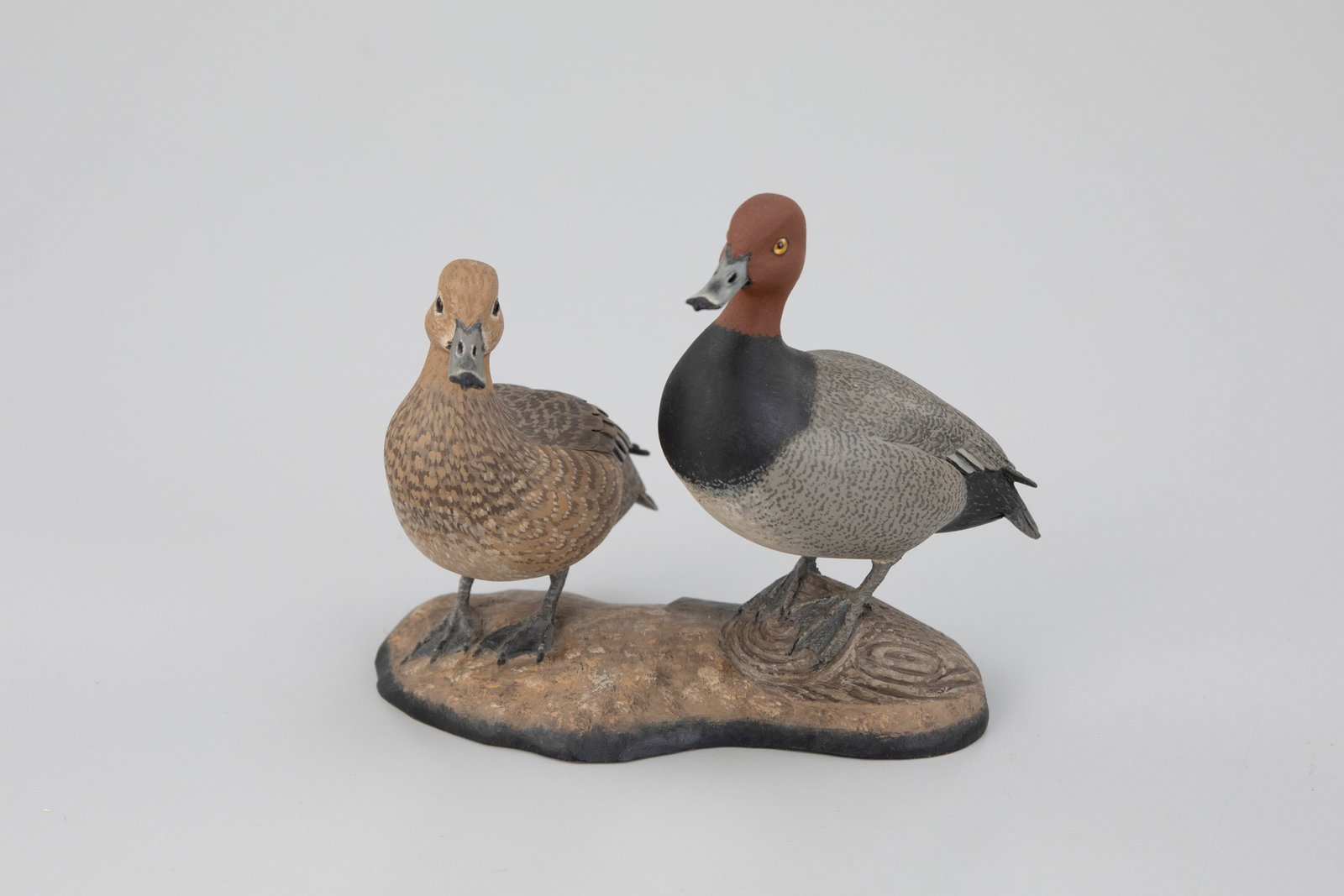 Miniature Redhead Pair, Eddie Wozny (b. 1959): Miniature Redhead Pair Eddie Wozny (b. 1959) Cambridge, MD, 2010 4 1/2 in. tall Retains the maker's signature, incised "W," and date on the bottom. Original paint with minimal wear. Provenance: