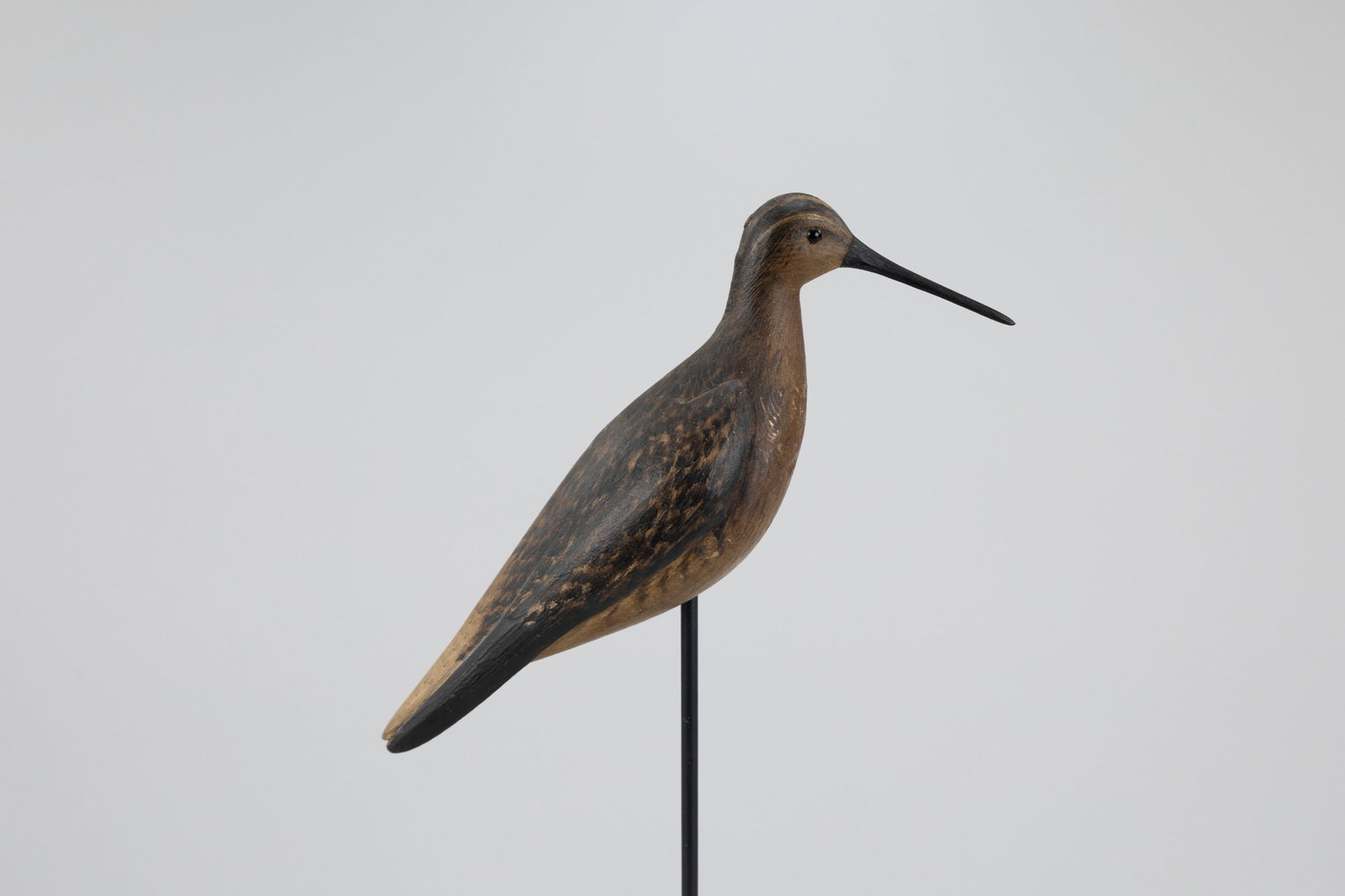 Dowitcher Decoy, Mark McNair (b. 1950): Dowitcher Decoy Mark McNair (b. 1950) Craddockville, VA 10 1/2 in. long The underside of the carving bears an incised ?McNair? signature. Original paint with light wear, a tight crack in breast, and s