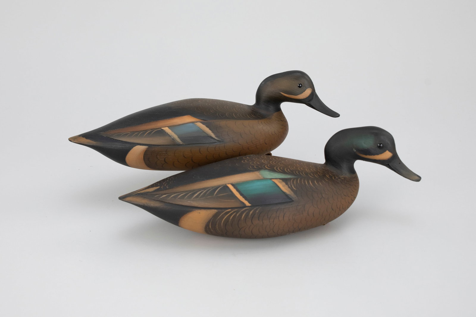 Blue-Winged Teal Decoy Pair, Sean Sutton (b. 1967): Blue-Winged Teal Decoy Pair Sean Sutton (b. 1967) Paulsboro, NJ 13 1/2 in. long The undersides of the hollow decoys are stamped and their weight are stamped. Original paint with light wear. Provenance