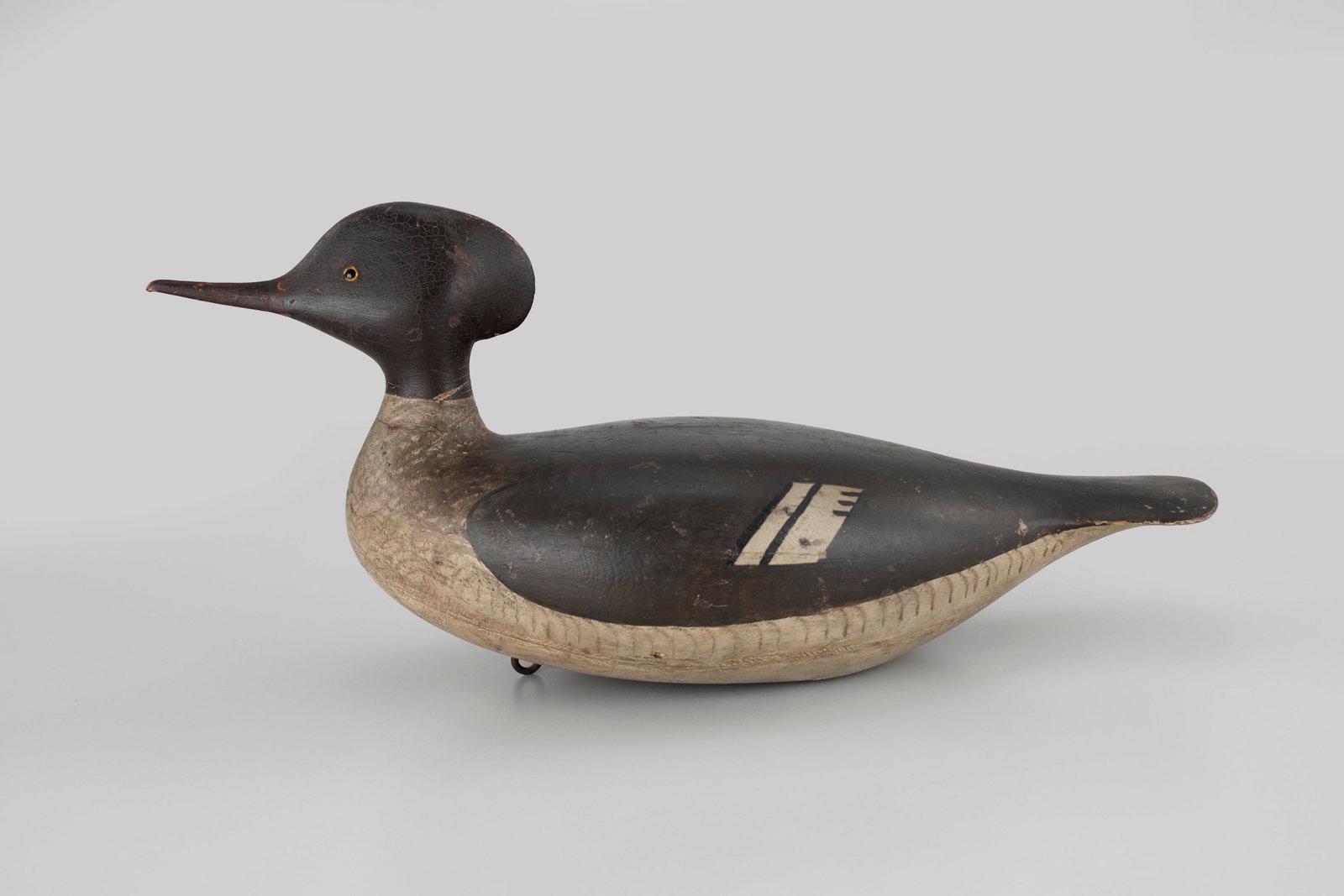 Important Merganser Hen by George H. Boyd (1873-1941): Important Merganser Hen George H. Boyd (1873-1941) Seabrook, NH, c. 1910 19 in. long "Jim reserved special spots on his shelves, fireplace, and walls for his favorite birds. I remember the first time