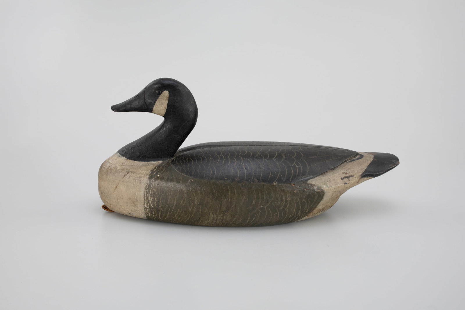 Rare Canada Goose by Percy Gant: Rare Canada Goose Percy Gant Osbornville, NJ, c. 1930 22 in. long A rare decoy with highly articulated carving details and excellent scratched feathering. The underside has a partial Philadelphia Wate