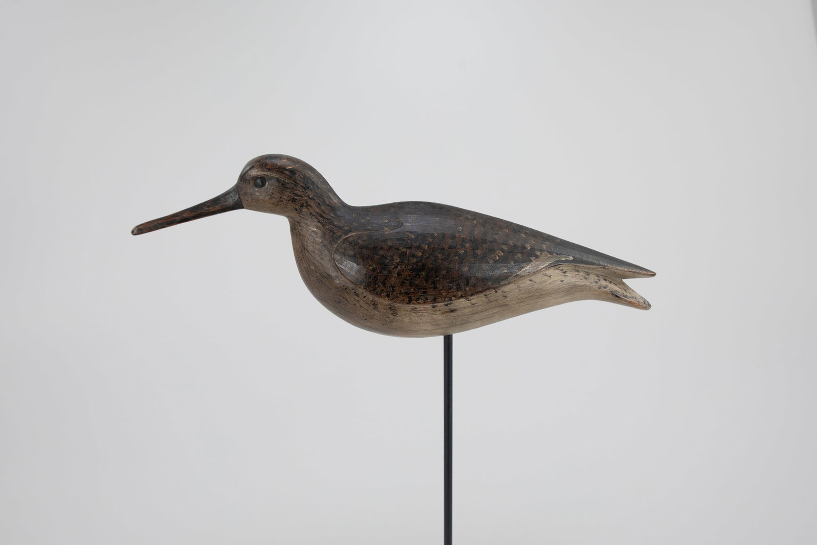 Reaching Willet by Mark McNair (b. 1950): Reaching Willet Mark McNair (b. 1950) Craddockville, VA, c. 1980 14 in. long A large shorebird with raised wings and a knife-carved finish. The underside of the carving bears an incised "McNair" signa