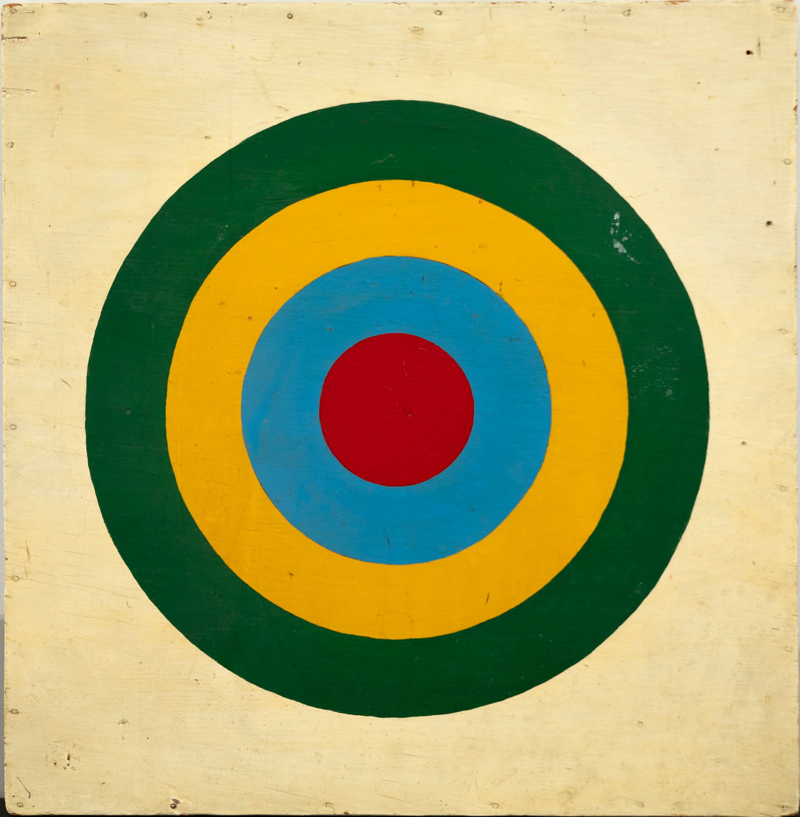 Bullseye: Bullseye 21 1/4 by 20 1/2 in. A target of some sort, four concentric circles in red, blue, yellow, and green are painted on a cream background. With a clean and tight design, the colors here work in