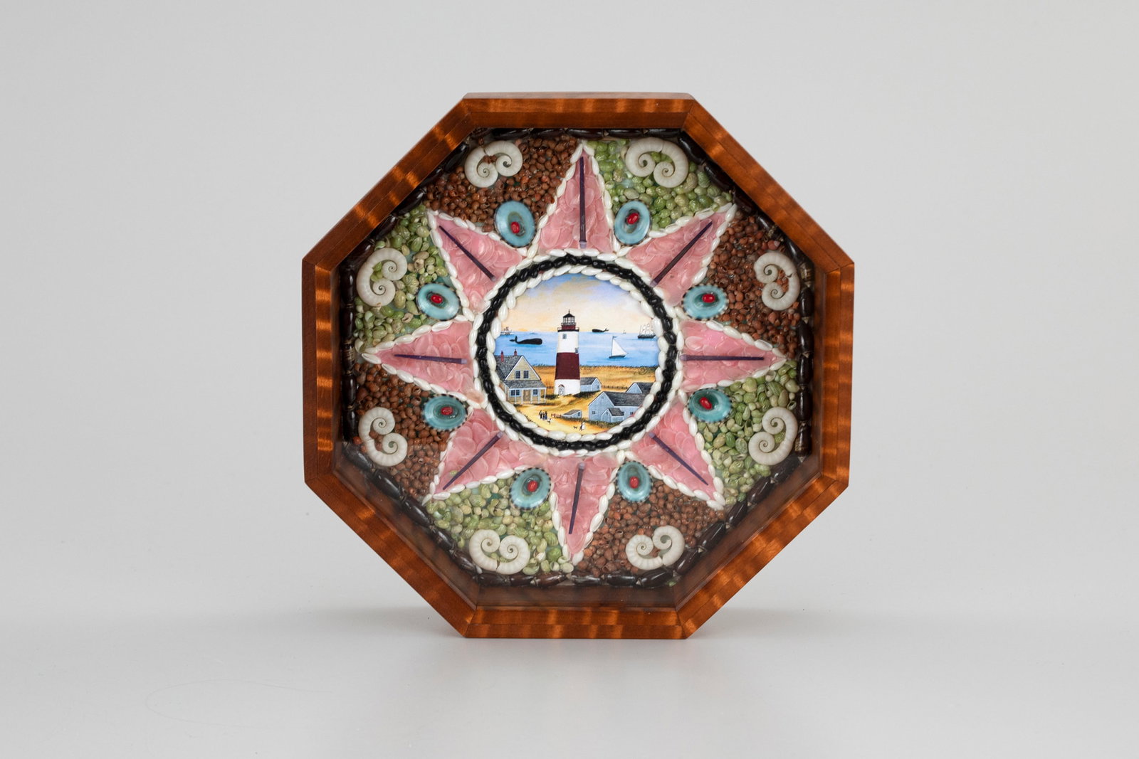 Two Sailor's Valentines by Harry Bextel (b. 1935): Two Sailor's Valentines Harry Bextel (b. 1935) New Haven, CT each is 9 1/2 by 9 1/2 in. Two hexagonal tiger-maple boxes with carefully arranged interiors. The first has a center round print of a