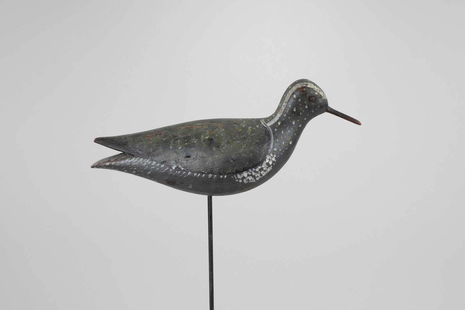 Golden Plover by Captain James Wyer (1816-1899): Golden Plover Captain James Wyer (1816-1899) Nantucket, MA, c. 1880 11 in. long An adult with green, gold, and white plumage. Original paint with gunning wear, thin ding on left, and a few old nails
