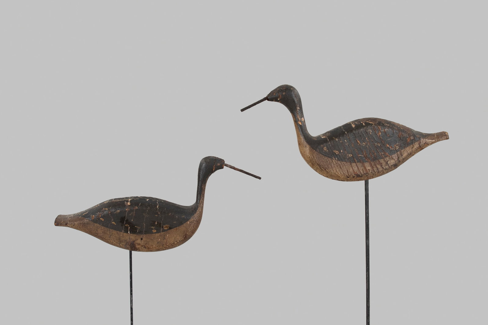 High-Head Yellowlegs Pair: High-Head Yellowlegs Pair Cape Cod, MA, c. 1880 10 in. long These two striking decoys were carved with very thin and alert head positions, reminiscent of the famous Kankakee pintail rig. They were