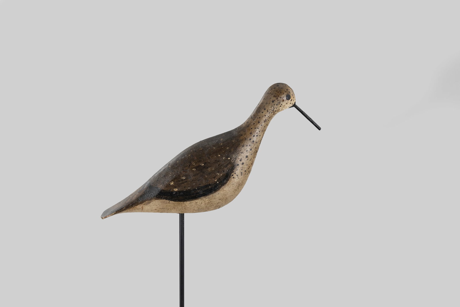 Willet: Willet Massachusetts, c. 1900 12 in. long This decoy has a thin tail, fancy paint, a wire bill, and was carved from a two-inch board. Original paint with gunning wear and touch-up to bill.