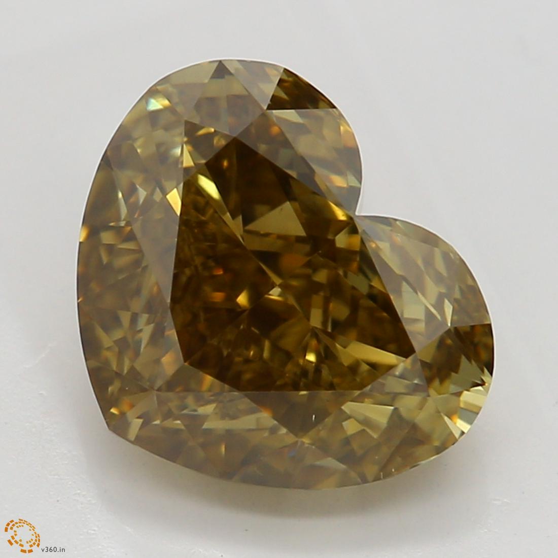 2.21 ct, Yellow Brown/VS2, Heart cut Diamond: Carat: 2.21 Cut: Heart Color: Natural Fancy Dark Yellow Brown Even Clarity: VS2 Symmetry: Good Polish: Excellent Fluorescence: None Report: GIA (Gemological Institute of America) Graded Certificate Ap