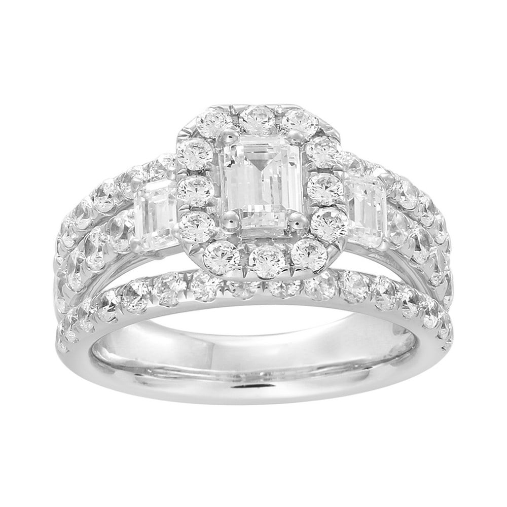 18kt White Gold 2.96ct Diamond Emerald cut Engagement Ring: Gold Content: 18kt White Gold Size (US): 7 Gold Weight in gram (approximate): 9.82 Shape of Diamonds: Emerald center + Round sides # of diamonds Including Center: 55 Size Range of Diamonds: 0.029