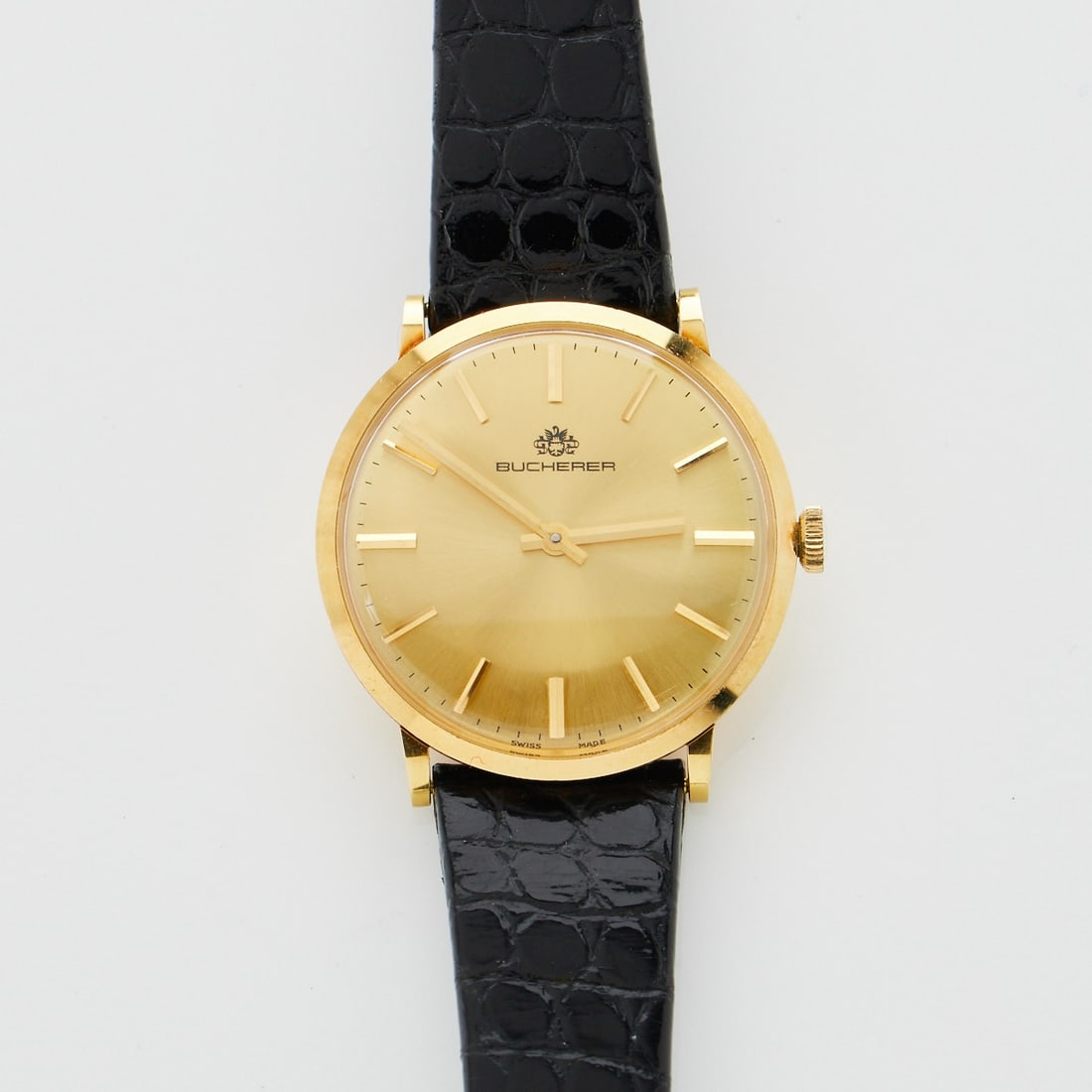 BUCHERER - Herrenarmbanduhr: BUCHERER - HerrenarmbanduhrFa. C. Bucherer, Schweiz. Mid-Century, 1960 - 1970er Jahre. 750/- Gelbgold, gestemp. Gew.: 31 g. Auf dem Zifferblatt bez: Bucherer. Auf dem Boden num.: 1211, 18 K. Gehä