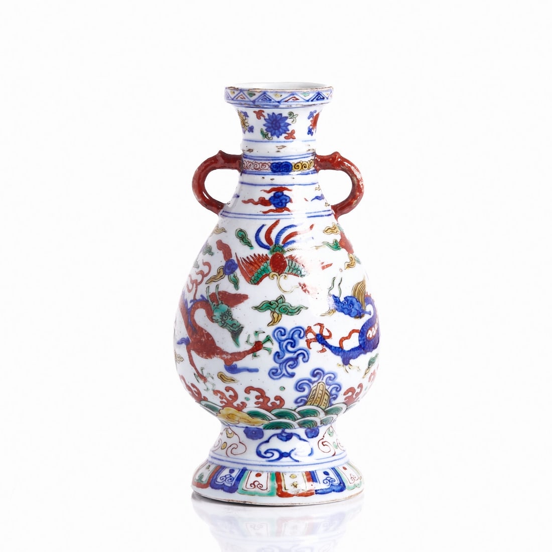 Porcelain Wucai Baluster Vase with Ming Dynasty Base Mark: Porcelain Wucai Baluster Vase with Ming Dynasty Base Mark China, Qing Dynasty. Porcelain, glazed, with Wucai painting over the glaze. H. 23.5 cm. Dragon decorations over waves on the belly, with depic