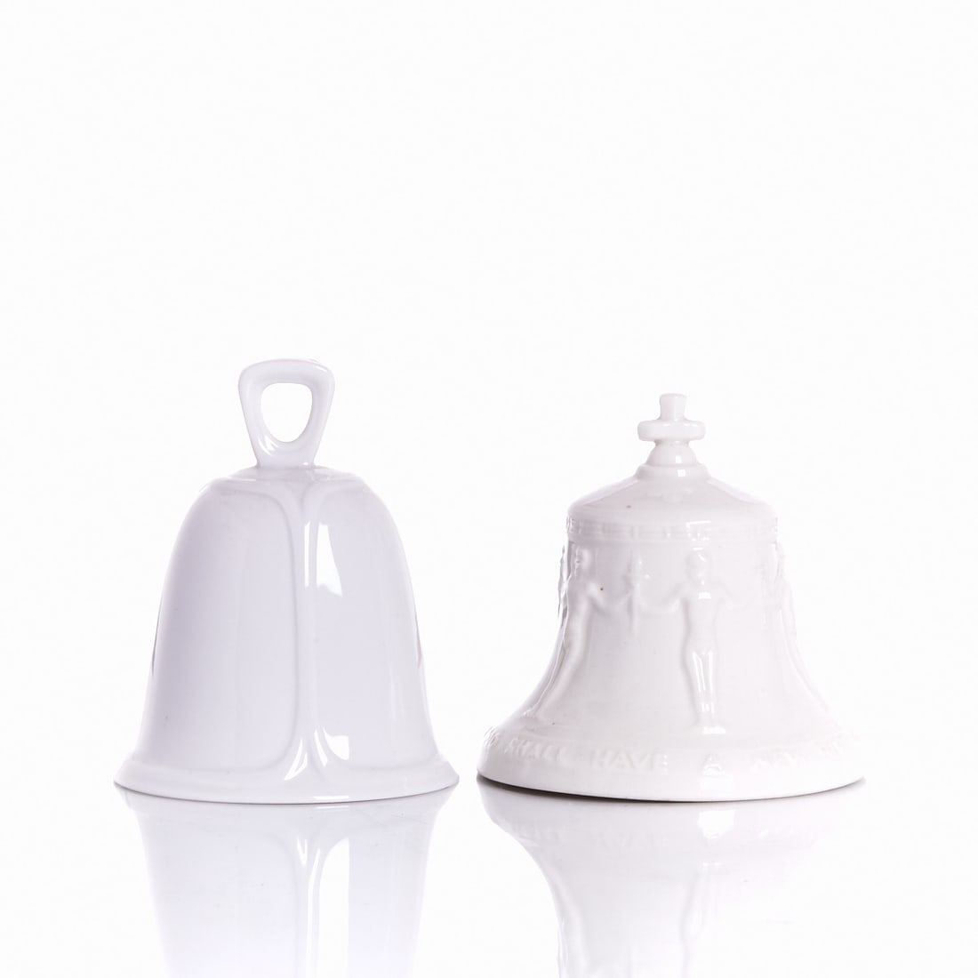 2 different table bells - "peace bell" and relief decoration Porzellanmanufaktur Goebel,: 2 different table bells - "peace bell" and relief decorationPorzellanmanufaktur Goebel, Oeslau-Rödental and Porzellanmanufaktur Fürstenberg, 1960s. White porcelain, glazed. In relief. Blue marks und