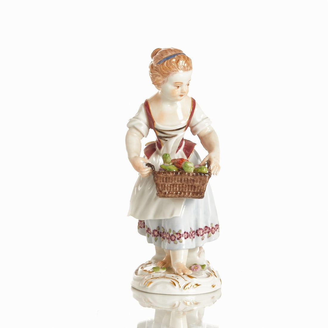 Gardener child with vegetable basket - Johann Joachim Kaendler, Meissen 2002: Gardener child with vegetable basket - Johann Joachim Kaendler Staatliche Porzellan Manufaktur, Meissen 2002. Porcelain, white, glazed. Polychrome and gold painted. Blue sword mark under the glaze. 1s