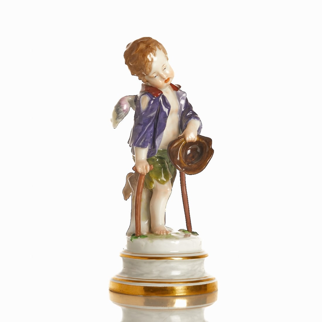 Cupid as Beggar - Heinrich Schwabe, Meissen 1850-1924: Cupid as Beggar - Heinrich Schwabe Royal and State Porcelain Manufactory, Meissen 1850-1924. Porcelain, white, glazed. Polychrome painted. Gold rim. Blue pommel-sword mark under the glaze. 1st choice.