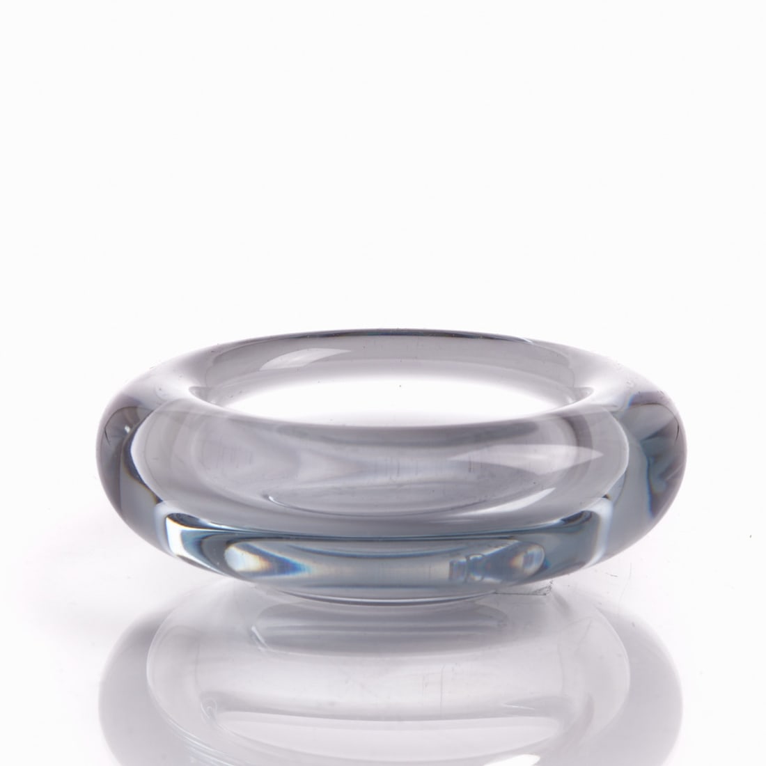 Small Bowl. Per Lütken for Holmegaard / Denmark 1960.: Small Bowl Per Lütken for Holmegaard / Denmark 1960. Thick-walled, light blue glass. Marked on the base: HOLMEGAARD 19 PL (ligated) 61. H. 3 cm, D. 8 cm. Per Lütken (Copenhagen 1916 - 1998 D