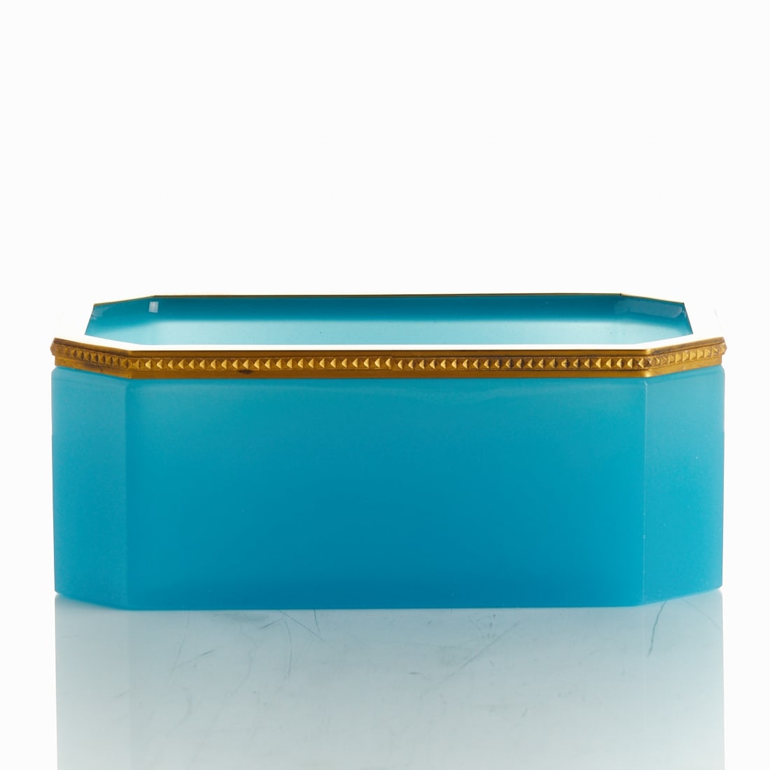 Large, octagonal bowl - Art Deco. France, circa 1935-1940.: Large, octagonal bowl - Art Deco France, circa 1935-1940. Thick-walled, petrol-colored opal glass, slightly translucent, cut and polished. Embossed brass mounting. H. 9 cm, 14 x 23 cm.