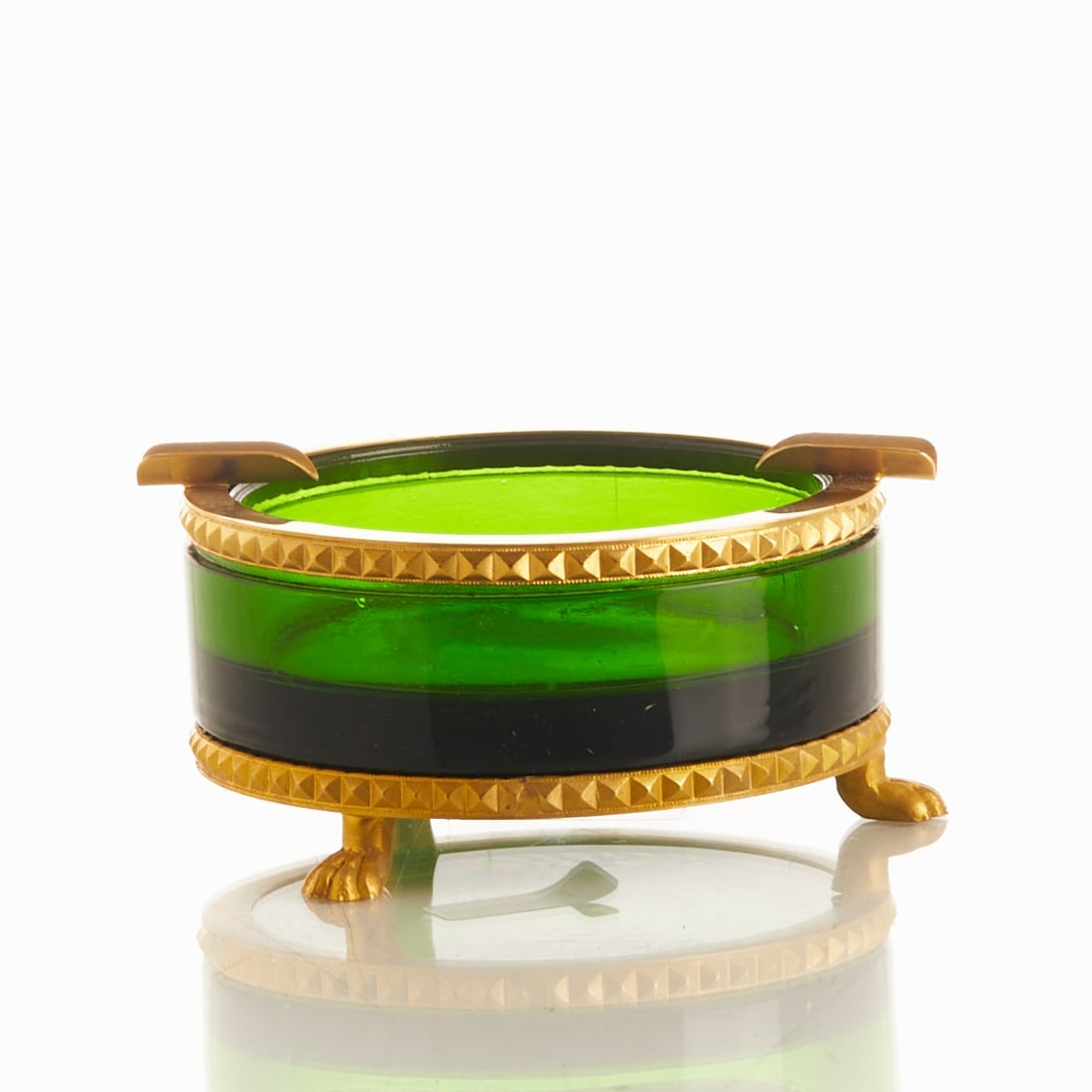 Round Ashtray on Mount with Lion's Feet - Art Déco. France, circa 1935-1940.: Round Ashtray on Mount with Lion's Feet - Art Déco France, circa 1935-1940. Thick-walled, green glass, cut and polished. Decorated brass mounting with two trays. Decorated mounting with lion's