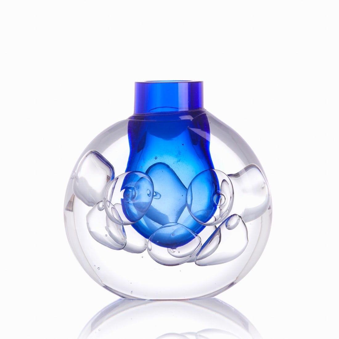 Vase. Jaroslav Svoboda, Skrdlovice / Czech Republic 1970s.: Vase Jaroslav Svoboda, Skrdlovice / Czech Republic 1970s. Thick-walled, colorless glass with large, embedded air bubbles and a blue inner casing. Marked on the base: J. SVOBODA. Paper sticker on the b