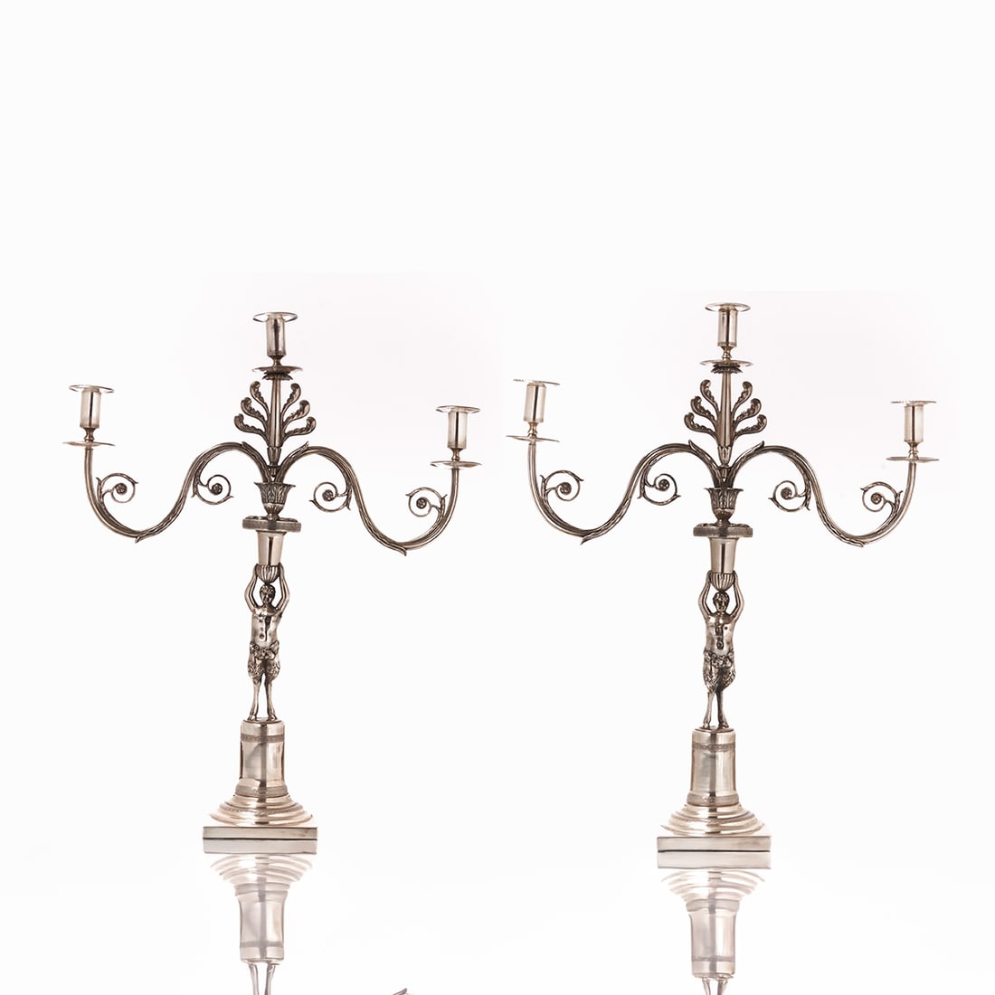 Rare pair of Empire girandoles: Rare pair of Empire girandoles George Heinrich Steffen/Berlin circa 1805. Silver. Hallmarks: Maker's mark, bear, year stamp. H. 62 cm. Weight: 5164 g. Restored. - Lit.: W. Scheffler, Berliner