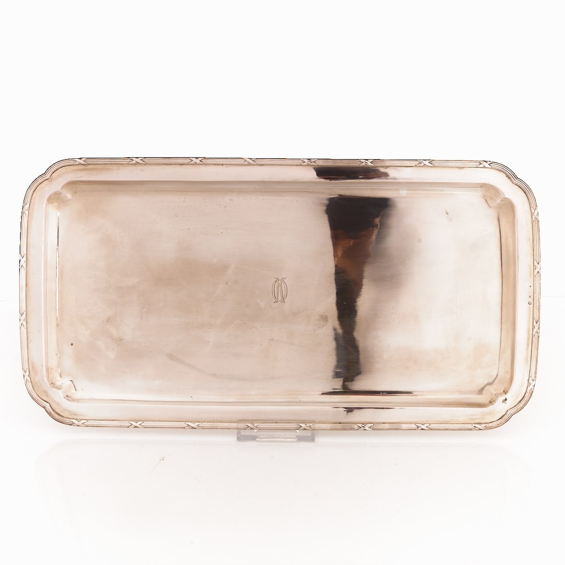 Tray with cross-ribbon decor: Tray with cross-ribbon decor Lviv/Ukraine/Austria, circa 1900. 800 silver. Hallmarks: Maker's mark, Diana's head. 1 x 40 x 20 cm. Weight: 574 g. Monogr.