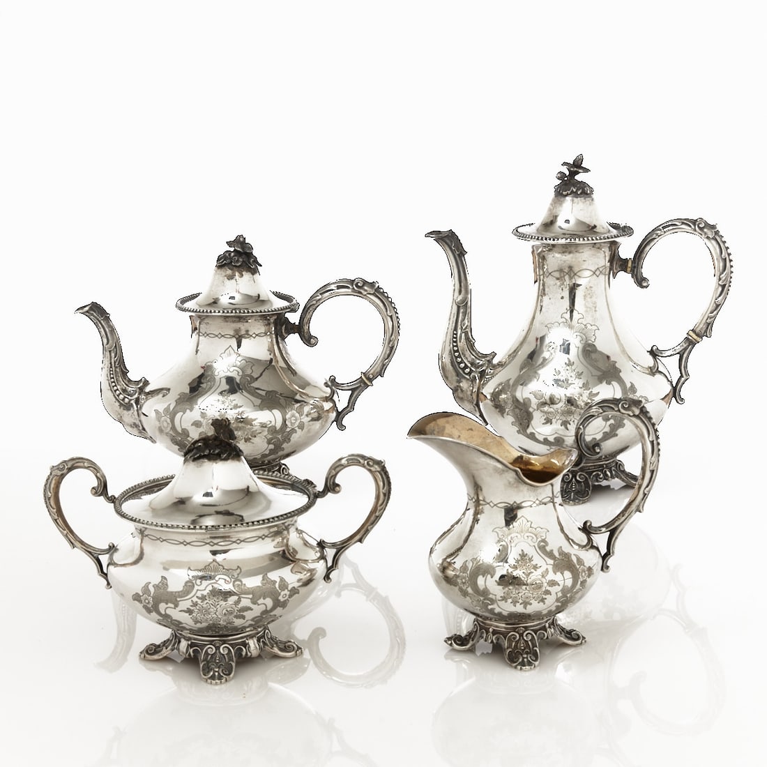 4-piece Biedermeier Coffee and Tea Set: 4-piece Biedermeier coffee and tea set Germany, circa 1840/50. 812.6 silver. Hallmarks: Maker's mark, 13. Weight: 1644 g. Dents. 1 coffee pot H. 26 cm. 1 teapot H. 20 cm. 1 sugar bowl H. 15.3 cm. 1