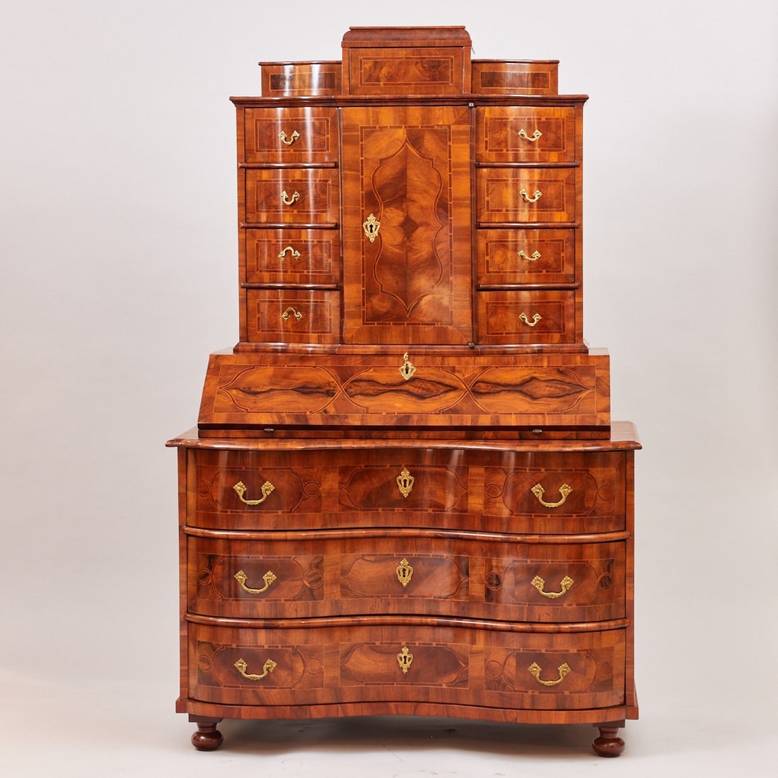 Baroque Top Secretary: Baroque Top Secretary18th century. Walnut. Fruitwood. Plum. 193 x 125 x 69 cm. On squat ball feet. Rectangular body with three bombe drawers and a slanted writing surface. Above, a tall rectangular