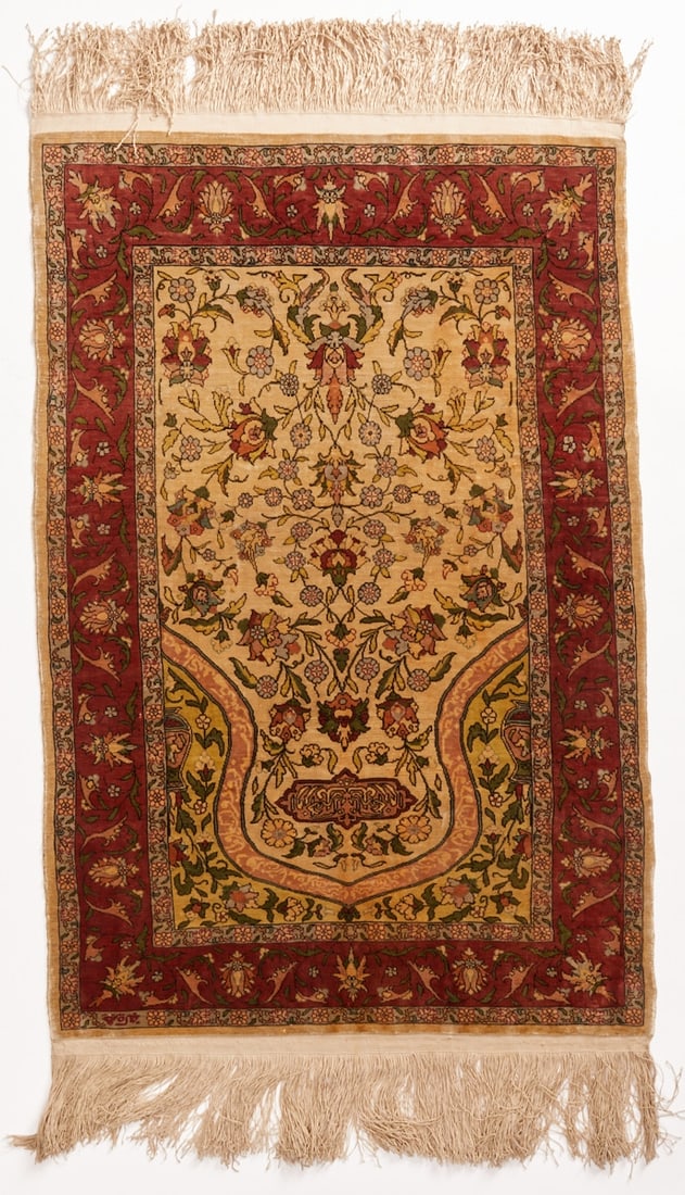 Qom: Qom Central Persia, mid-20th century. Pure silk on silk. Approx. 113 x 62 cm. Signature. The ivory-colored Mihrab field features an elegantly curved prayer niche with extremely finely crafted floral