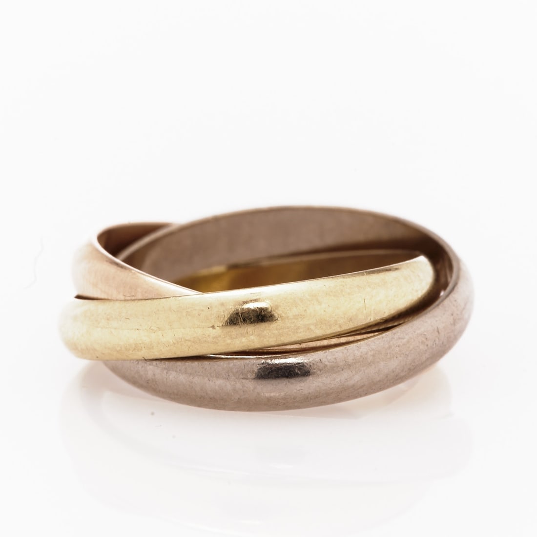 CARTIER - Trinity Ring: CARTIER - Trinity Ring Company Cartier, Switzerland. Model: Trinity. 750/- yellow gold, white gold and rose gold, hallmarked. Weight: 10.4 g. Hallmarks: Cartier, 750, 58, FL9338. Ring size 58. The