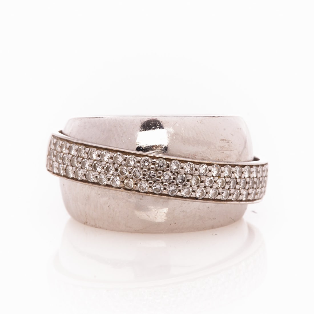 PIAGET - Pavé-set band ring "Possession Swing": PIAGET - Pavé-set band ring "Possession Swing" Company Piaget, Switzerland. Model: "Possession Swing". 750/- white gold, stamped. Total weight: 15.8 g. Approx. 65 brilliant-cut diamonds totaling 1