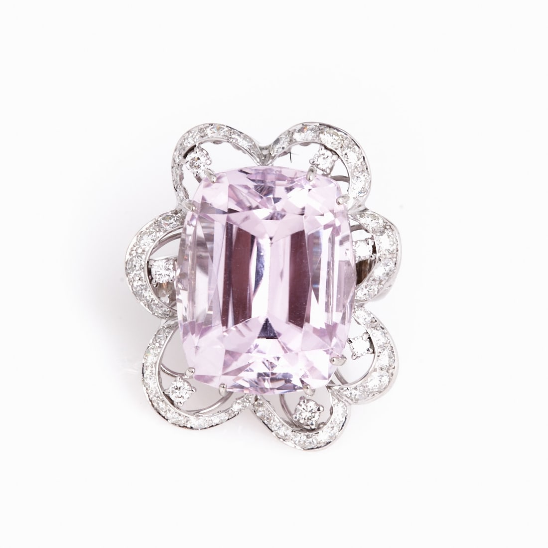 Large Kunzite Ring in Flower-Shaped Setting: Large Kunzite Ring in Flower-Shaped Setting 585/- white gold, hallmarked. Total weight: 20.5 g. 1 step-cut kunzite approx. 44.46 ct. Various brilliant-cut diamonds totaling approx. 3.6 ct. Ring size