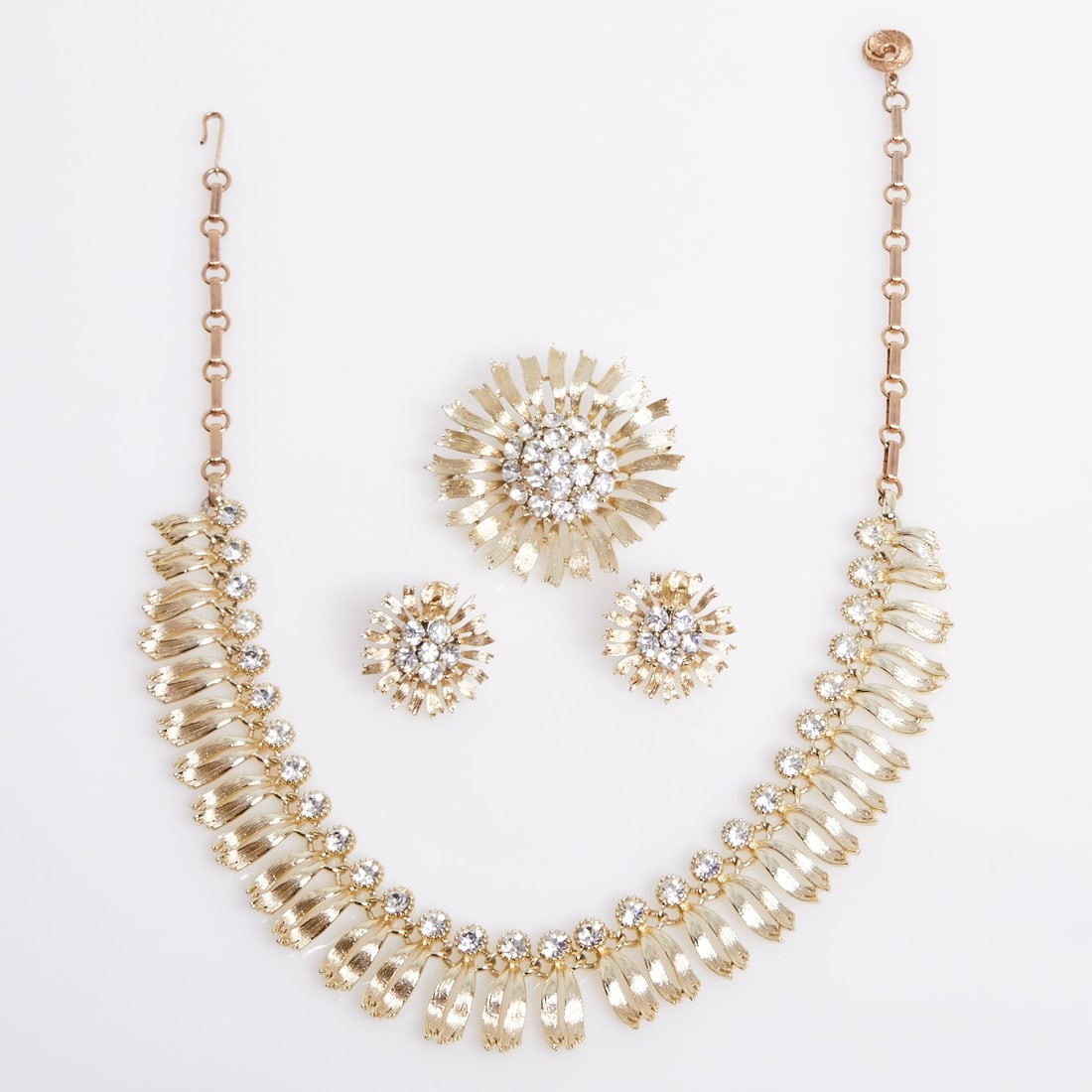 LISNER - Vintage Parure - ''Sunflower'' (3 Pieces): LISNER - Vintage Parure - ''Sunflower'' (3 Pieces). Necklace, brooch, and pair of clip-on earrings. Lisner, New York, circa 1950. Metal, likely gold-plated. Crystal rhinestones. Total weight: 90 g.