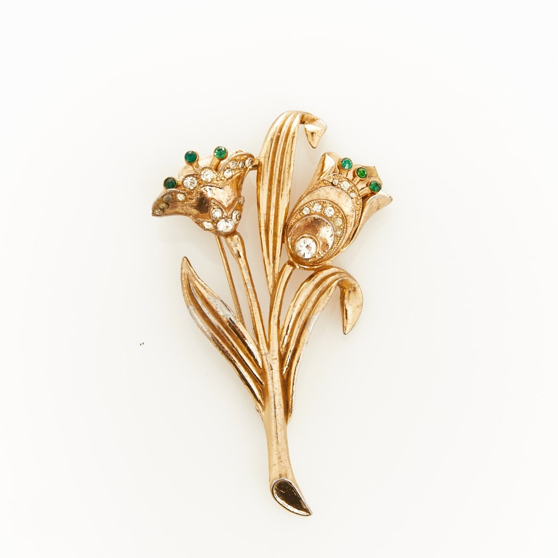 CORO - Vintage ''Double Tulip'' Brooch: CORO - Vintage ''Double Tulip'' Brooch Probably Coro (Cohn & Rosenberger Jewelry), New York, USA, circa 1950s. Metal, gold-coloured; crystal rhinestones; faux emerald. Weight: 33 g. Dimensions: 6