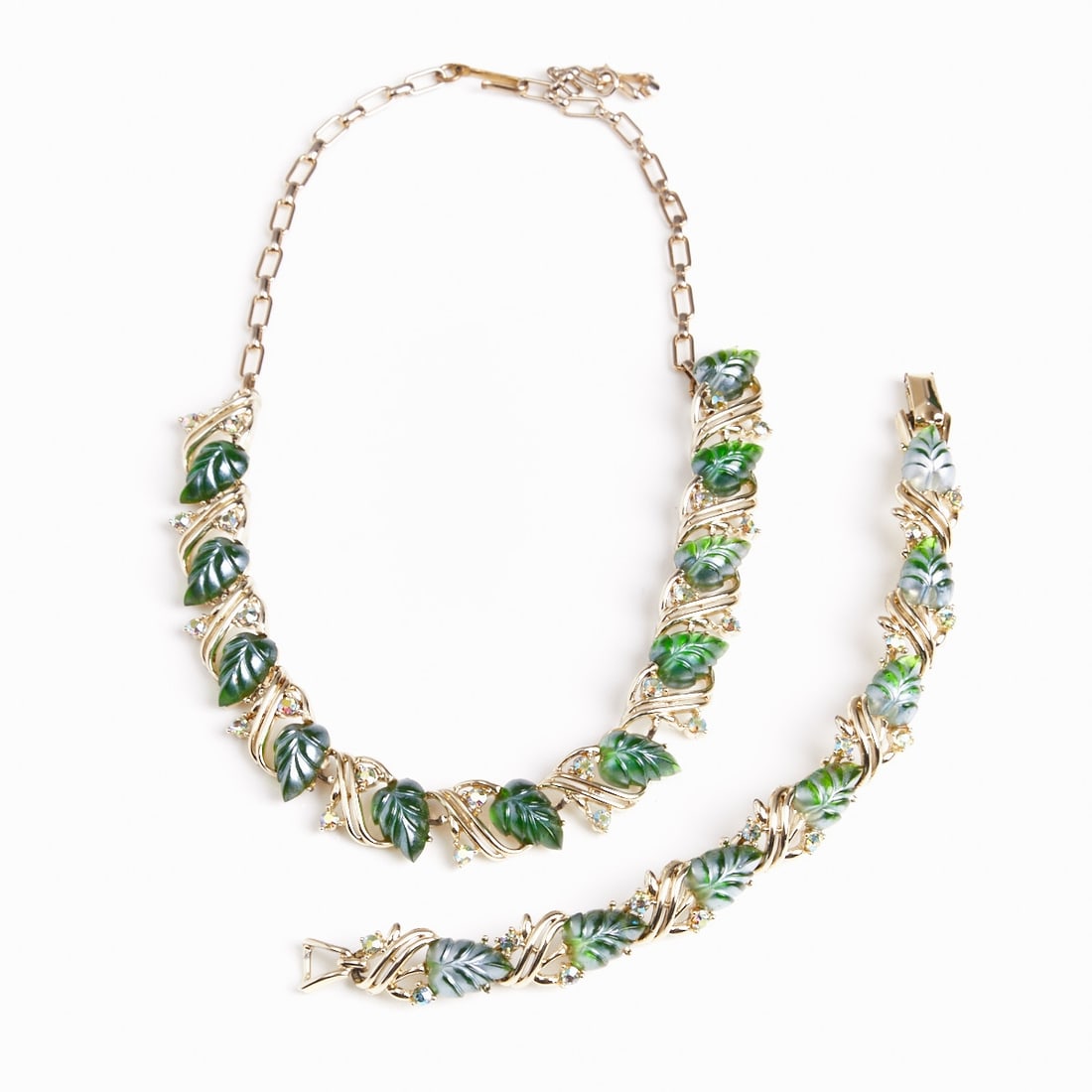 STAR - Vintage Green 'Jelly Leaf' Necklace with Matching Bracelet (2 parts): STAR - Vintage Green 'Jelly Leaf' Necklace with Matching Bracelet (2 parts) Star, Stütz GmbH, Austria, circa 1980s. Metal, white gold-colored; glass; rhinestones. Weight: 67 g. Dimensions: Neckla