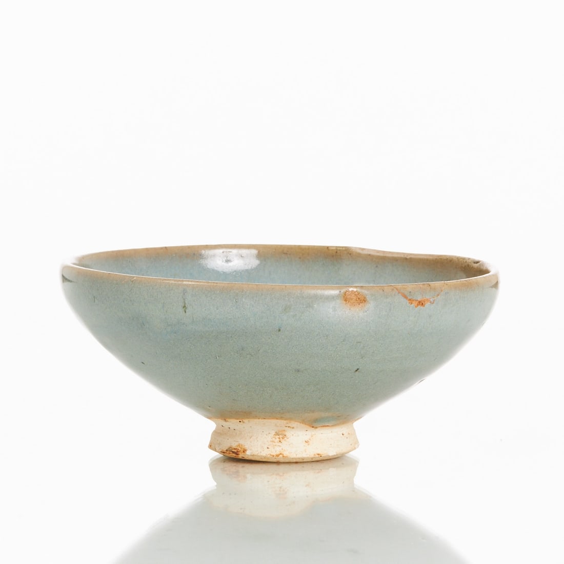An old bowl in the style of Song Junyao: An old bowl in the style of Song Junyao China, probably 18th century or earlier. Ceramic, glazed. H. 8 cm; D. of mouth 18 cm. Swirl-shaped base mark. Condition: Signs of age and wear; chip on the mout