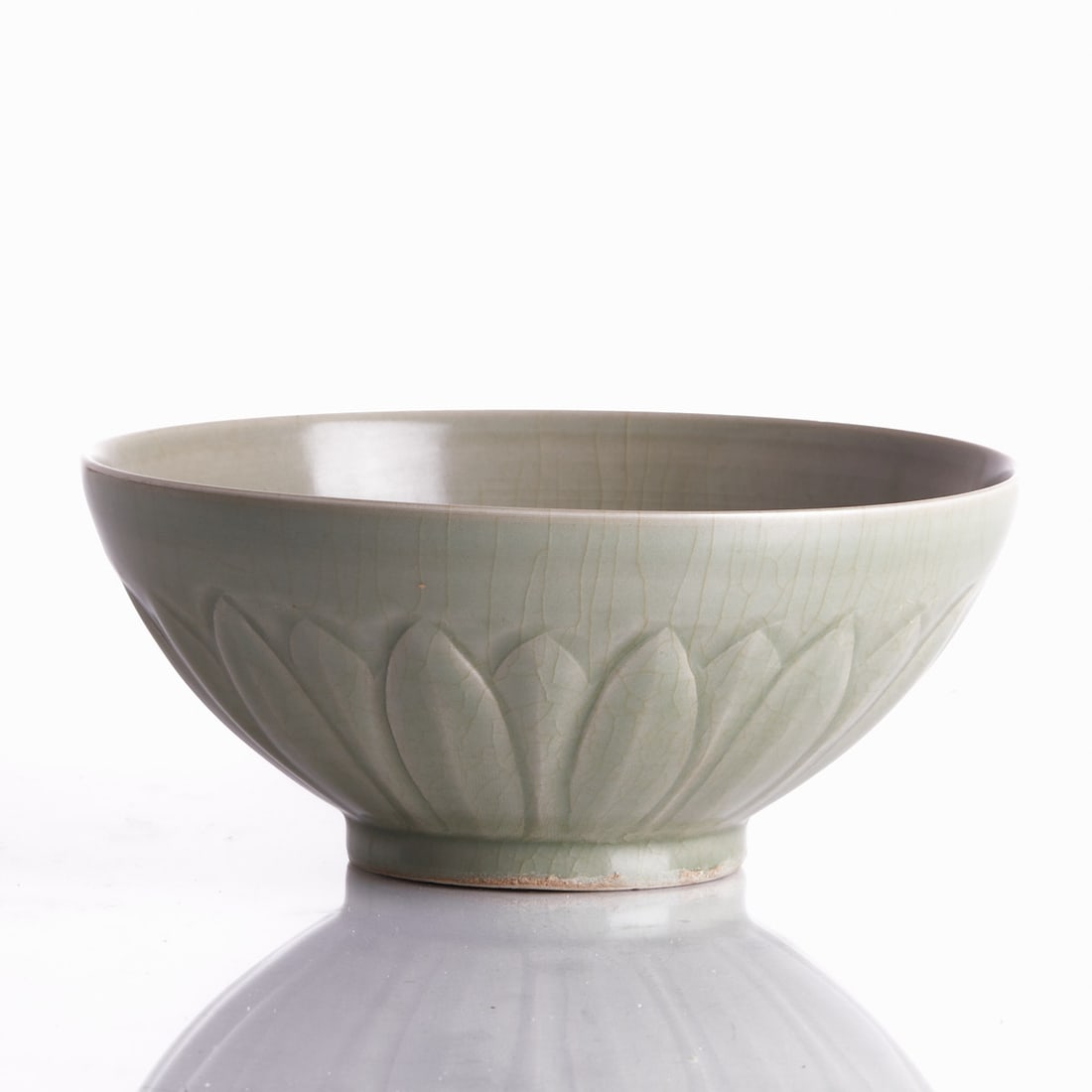Longquan Celadon 'Lotus' Bowl: Longquan Celadon 'Lotus' Bowl China, probably Yuan Dynasty or later. Porcelain, celadon glaze with beautiful craquelure pattern. H. 6.9 cm. D. of mouth: 15.8 cm. Good condition, without chips or