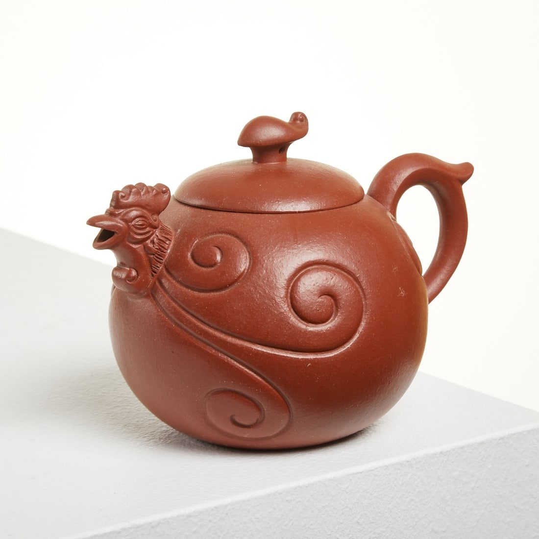 Chinese Yixing Zisha Teapot by Gu Jingzhou: Chinese Yixing Zisha Teapot by Gu Jingzhou China, 20th century. Zisha clay. H. approx. 10 cm. L. approx. 15 cm. Engraved bottom mark: Gu Jingzhou Zhi. Bulbous body in the shape of a rooster. Very