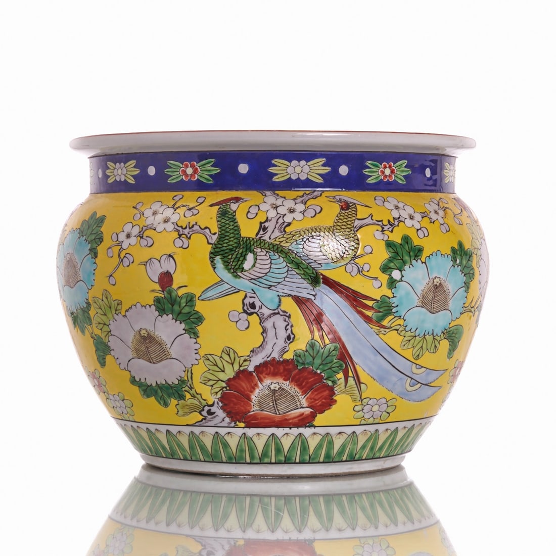 Round Cachepot ''Fish Bowl'': Round Cachepot ''Fish Bowl'' China, 20th century. Porcelain, yellow ground, polychrome decorated, glazed. The body with floral motifs. H. 28 cm, D. 35.3 cm. Very good condition. A Chinese porcelain