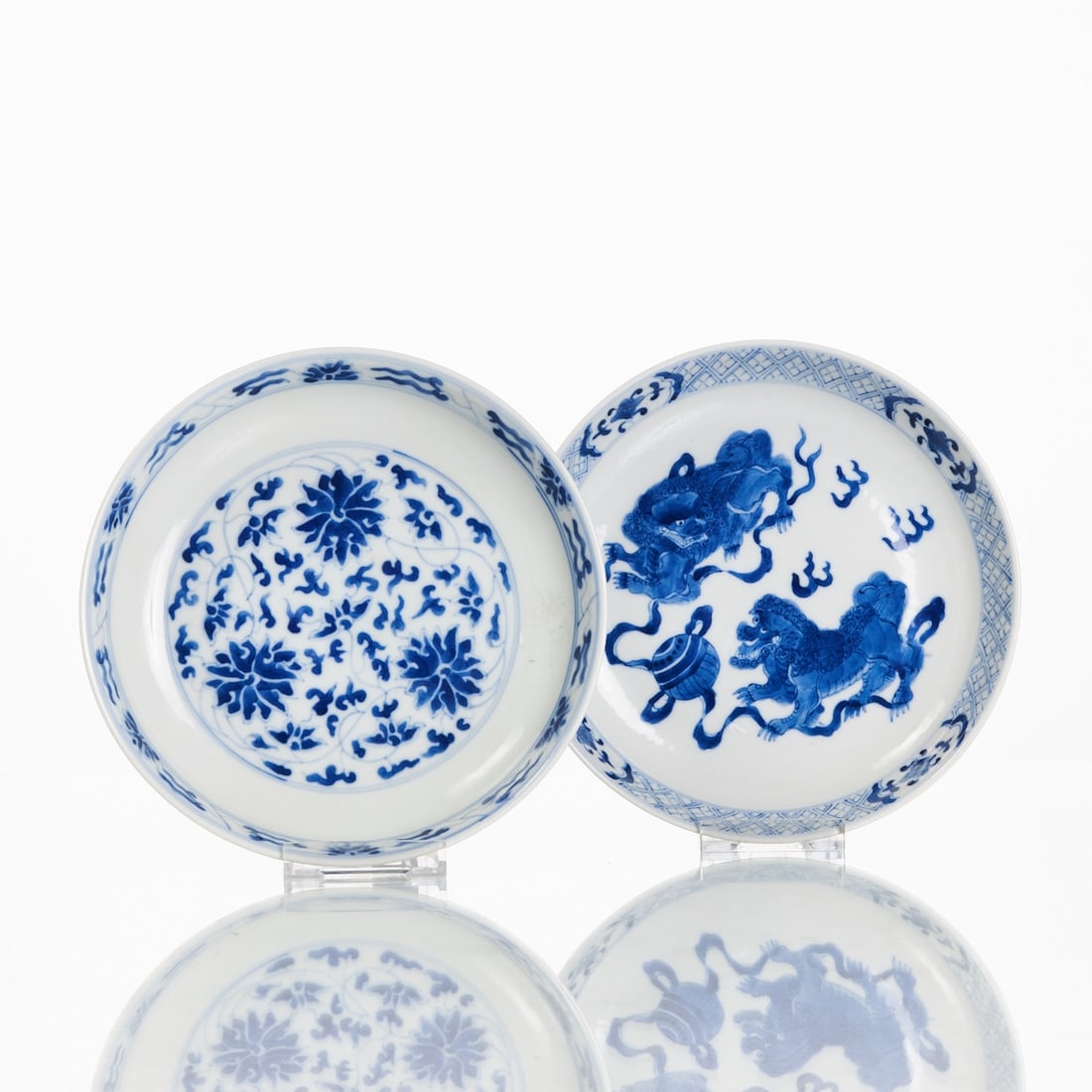 Two Blue-and-White Plates: Two blue-and-white plates China, Republic period, 20th century or earlier. Porcelain, painted in underglaze blue. H. 4.2 cm and 4 cm; D. 19.4 cm and 19.7 cm. One plate with floral motif, the other