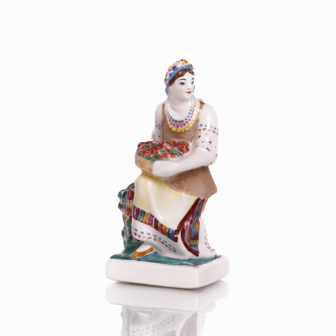 Figure 'Ukrainian Woman with Tomatoes'. Natalja Danko. Lomonosov / Lomonossow Leningrad (LFZ),: Figure "Ukrainian Woman with Tomatoes" - Natalja Danko Lomonosov / Lomonossow Leningrad (LFZ), 1937-1939. Porcelain, white, glazed. Polychrome painted. On the unglazed base, green mark LFZ (