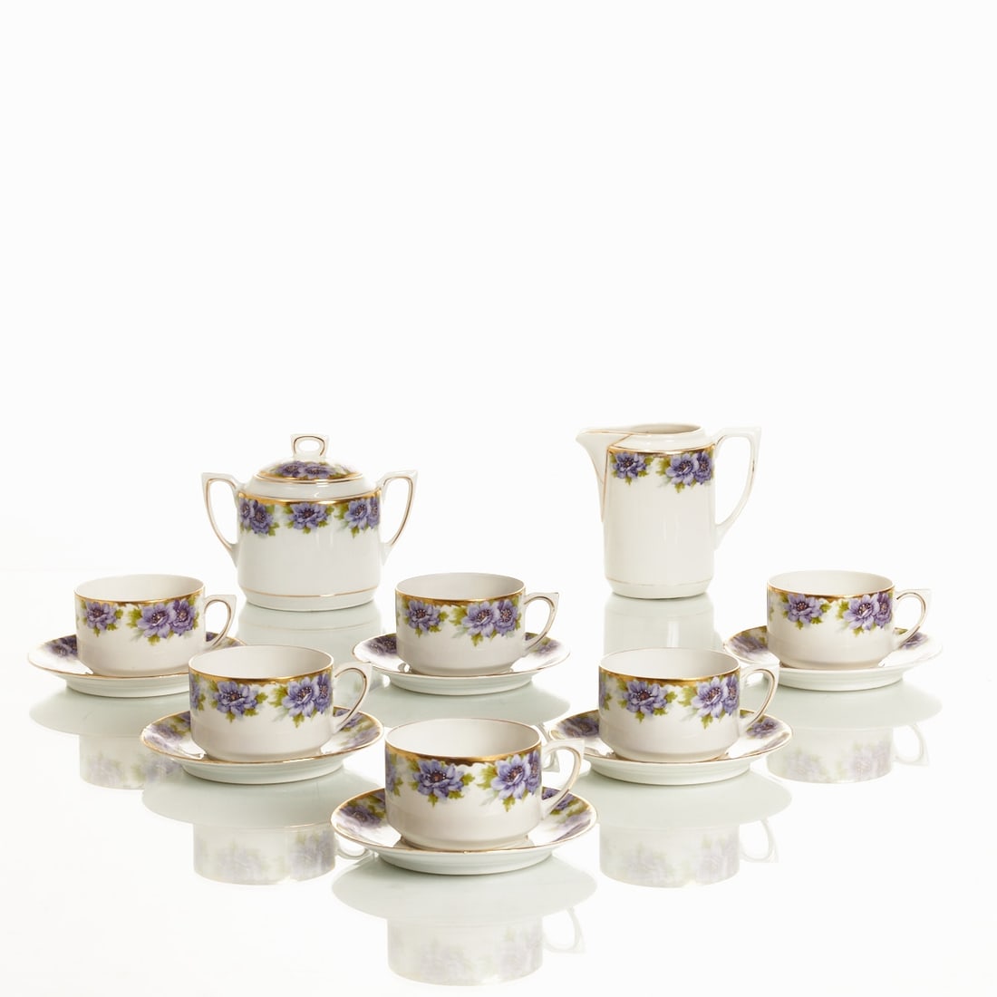 6 Coffee Cups with Saucers, Creamer and Sugar Bowl - Violet Anemones, Carl Tielsch & Co., Altwasser: 6 coffee cups with saucers, creamer and sugar bowl - Violet Anemones Carl Tielsch & Co., Altwasser 1909-1935. Porcelain, white, glazed. Polychrome transfer print decor. Gold rim. Underglaze green 