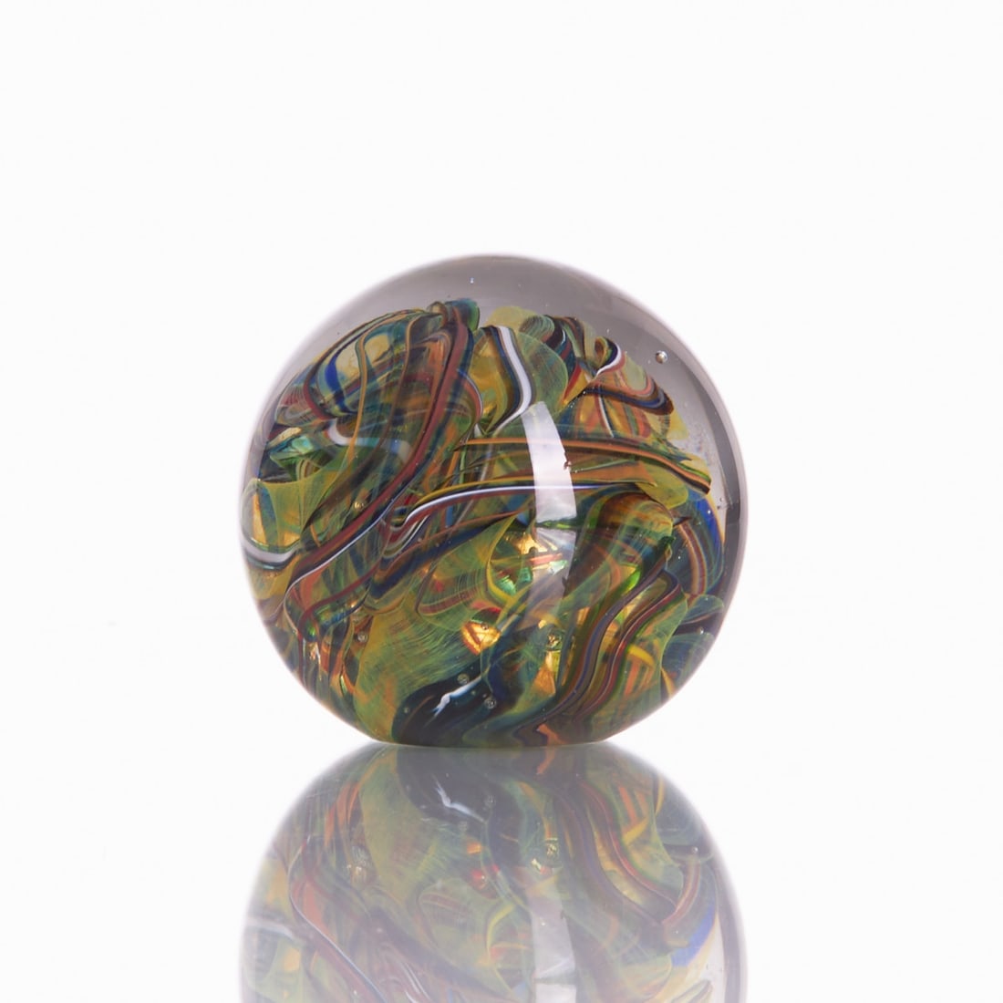 Paperweight: Paperweight Colorless glass, with melted-in green, yellow, orange, blue and opaque white fusions, drawn differently. Unmarked. H. 9 cm.