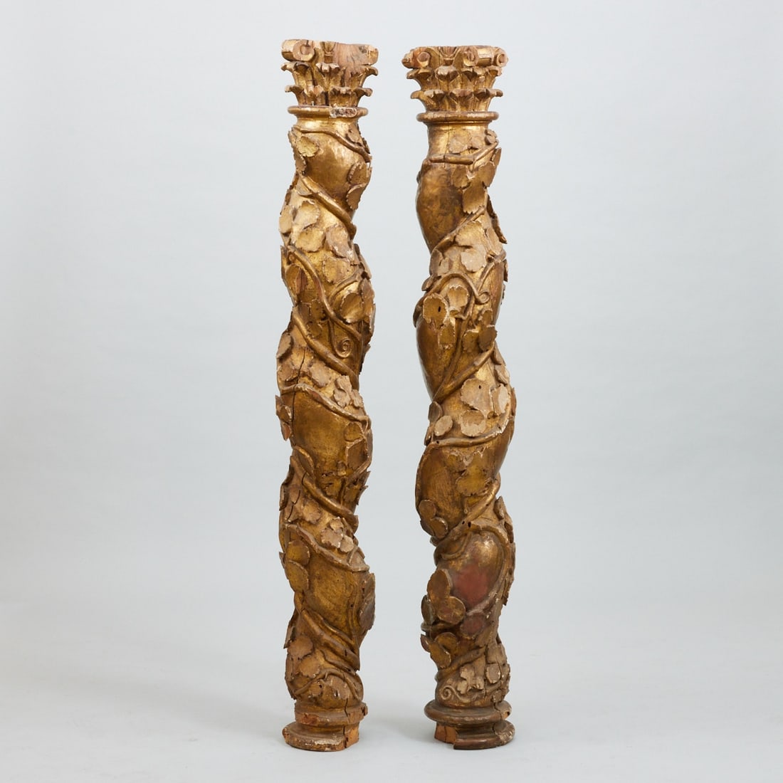 Pair of Baroque columns: Pair of Baroque columns Southern Germany, 18th century. Polychrome wood. H. up to 166 cm. Restored condition. Twisted column shaft with relief-sculpted decoration of vine tendrils. Topped with a